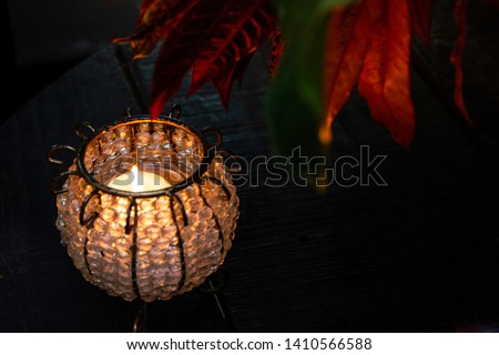 Candle lamp on wooden table. Decoration candle light.