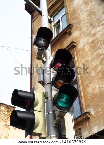 Many traffic lights on one pillar