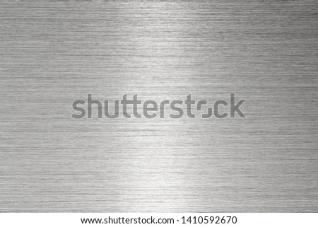 Fine brushed metal with highlight in middle. Royalty-Free Stock Photo #1410592670