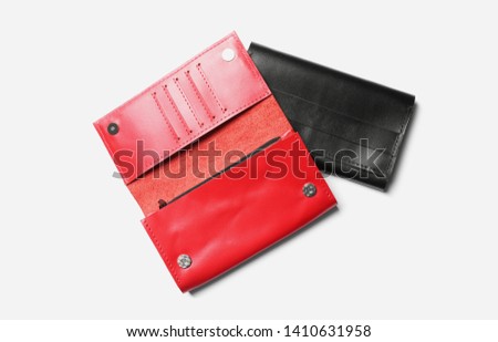 Stylish leather wallets on white background, top view