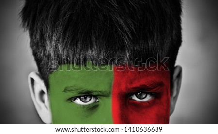 Red and green Bangladeshi flag textures painted on a face of young boy
