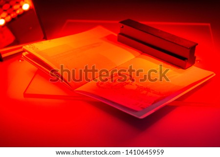 Checking the passport for fraud in UV and another light, detection of luminescence of protective components of the document (threads, melange fibers), special elements of high security print