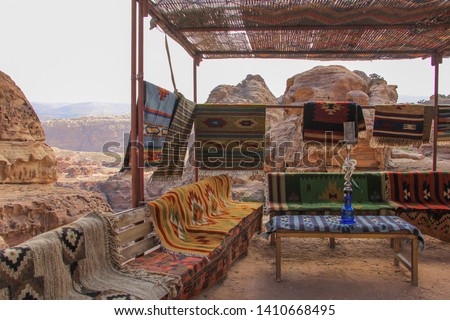 Traditional cafe on mountain with carpets and hookah in a famous historical and archaeological city. Petra, Jordan