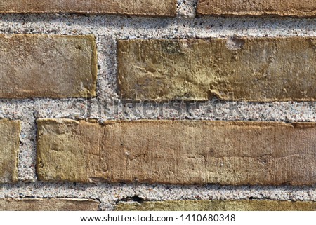 Close up view on colorful weathered and aged brick walls in high resolution