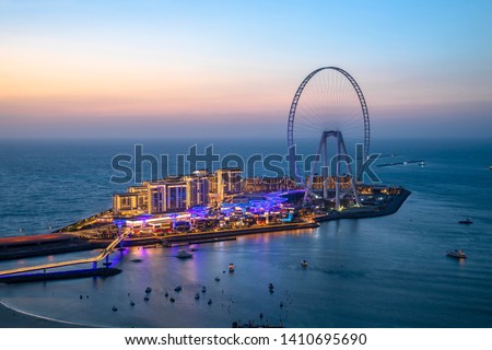 Beautiful sunset from Jumeirah Beach Residence overlooking Bluewaters Dubai Royalty-Free Stock Photo #1410695690