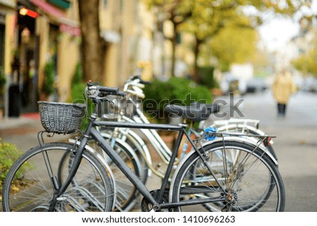 Bicycles parked on beautiful medieval streets of Lucca city, known for its intact Renaissance-era city walls, Tuscany, Italy.