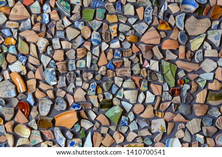 decorative background made with a lot of pieces of broken pottery or ceramic