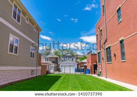Vacant Residential Lot with Green Grass in the University Village Neighborhood of Chicago  Royalty-Free Stock Photo #1410737390