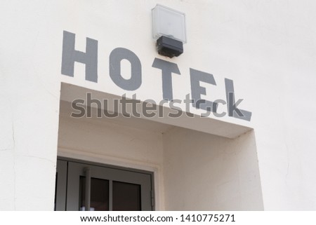 Old vintage hotel sign painted on a wall building