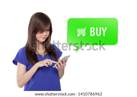 Young Asian woman shopping online, tap her finger at the green BUY button on smartphone, isolated on white background