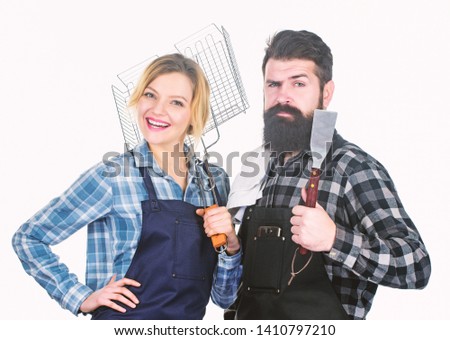 Family weekend. Picnic barbecue. food cooking recipe. Couple in love hold kitchen utensils. Man bearded hipster and girl. Preparation and culinary. Tools for roasting meat. Food habits.