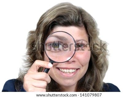 Young businesswoman holding Magnifying Glass, business photo