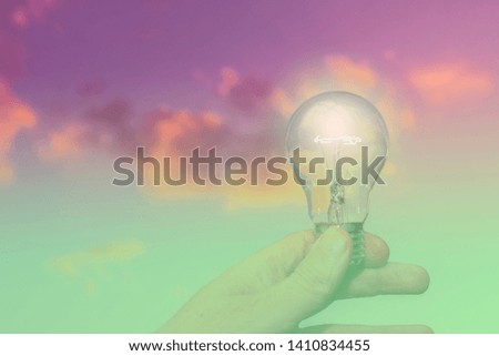 Hand holding the light bulb, concept of startup, idea and creativity. 