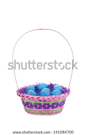 Image of blue eggs in pink  basket isolated on white background