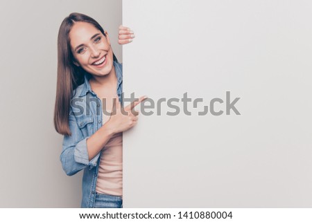Portrait of her she nice attractive lovely shine cheerful cheery positive straight-haired lady pointing forefinger at big large promotion ad advert isolated over light white gray background
