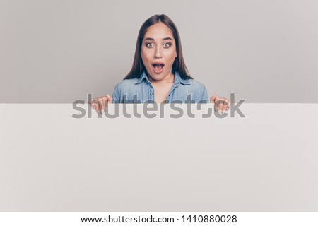 Portrait of her she nice attractive cheerful amazed straight-haired lady holding big large board saying news gossip isolated over light white gray background