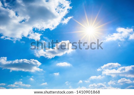 Summer background, wonderful blue sky with bright sun and clouds Royalty-Free Stock Photo #1410901868