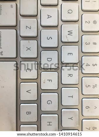 Dirty qwerty keyboard with white keys