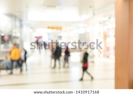 Blur store with bokeh background. Silhouettes of Business People in Blurred Motion Walking. Business people walking in the office corridor.