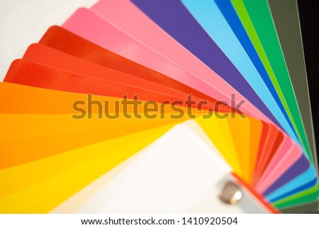 Close-up of color palette guide of stickers for decoration on white background.