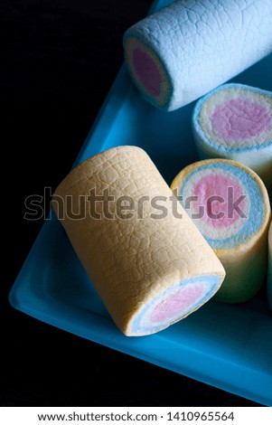 SWEETS OF CLOUDS ON DARK BACKGROUND
