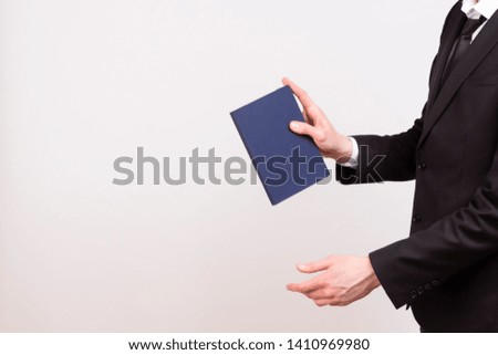 Young worker with a notepad in his hands