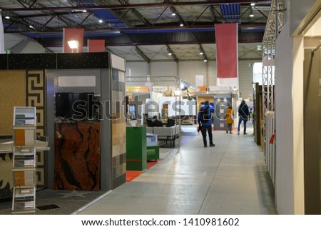 trade fair with different booths Royalty-Free Stock Photo #1410981602