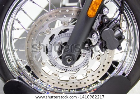 close up - wheel spokes and brake disc of a motorcycle concept new design technology