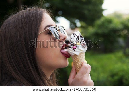 Girl eat Icecream on summer day 