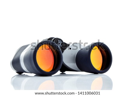 Silver gray and black binoculars isolated on white background