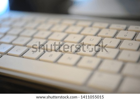 A computer keyboard is a typewriter-style device which uses an arrangement of buttons or keys to act as mechanical levers or electronic switches. Royalty-Free Stock Photo #1411055015