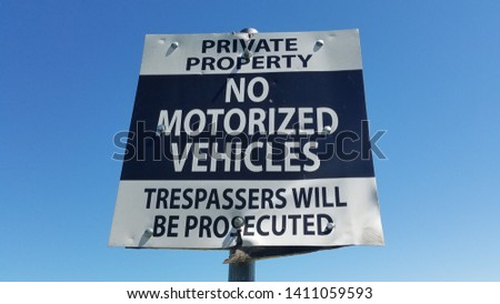 Sign private property no motorized vehicles trespassers will be prosecuted, damaged, tattered, beat up