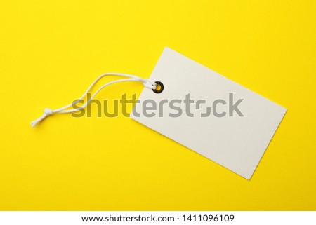 Cardboard tag with space for text on color background, top view