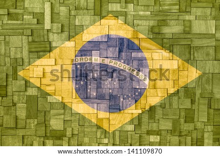 Brazilian Flag on a wooden Background Royalty-Free Stock Photo #141109870