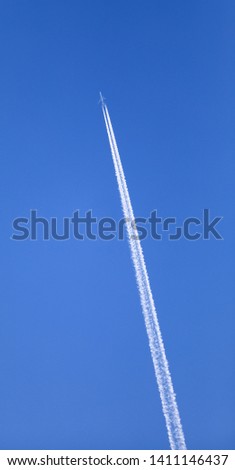 double track in the sky from a jet plane