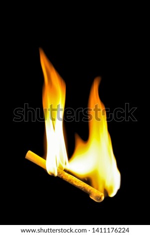 Closeup cigarette is burning on back background