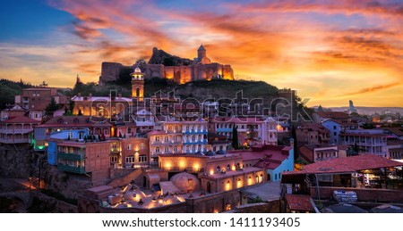 Old town of Tblisi in Georgia at a beautiful sunset Royalty-Free Stock Photo #1411193405