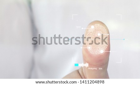 Businessman scan fingerprint biometric identity and approval. Biometric scanner scanning a human finger and identifying user for access. Future of security and password control through fingerprints. Royalty-Free Stock Photo #1411204898