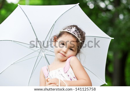 Princess in the park with umbrella