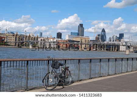 London, England, United Kingdom: Bicycle at railing on the background of the River Thames during the daytime