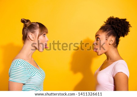 Porfile side view photo funny cute attractive teen teenager childish carefree rest fool make faces way curly hairdo style stylish trendy shadow top-knot summer modern outfit isolated yellow background