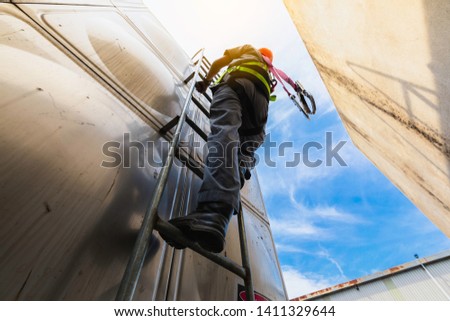 Worker ware safety belts  in construction site close up equipment safety concept,Worker high building outdoors sprinkle with rope safety sure, wear equipment protective on blue sky.