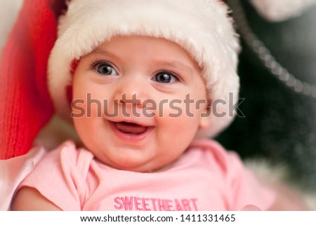 happy smiling girl in red new year costume
