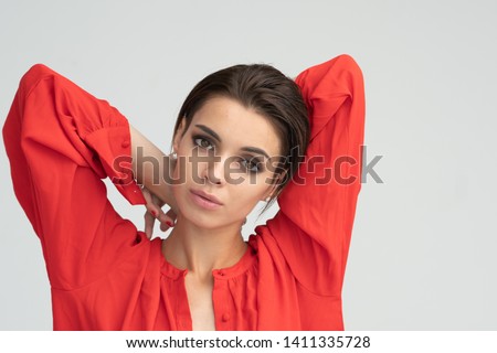 portrait of a young beautiful girl in red