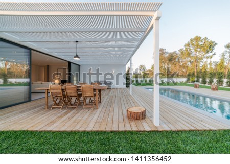 Modern villa with pool and deck with interior view