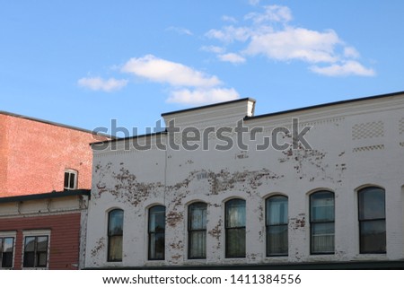 Rooftops of brick buildings on urban neighborhood block