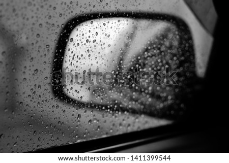 Fresh water drops after raining on glass window background in car.