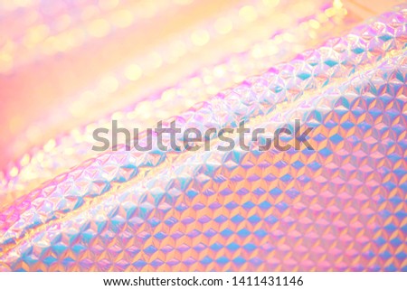 Holographic happy pastel rainbow  candy colored abstract wallpaper background texture with bright hexagon pattern and diagonal lines Royalty-Free Stock Photo #1411431146