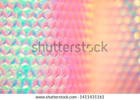 Holographic 90s retro rainbow neon candy colored abstract wallpaper background texture with smooth geometric pattern Royalty-Free Stock Photo #1411431161