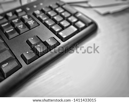 Computer keyboard on the table with copy space,black and white photo.